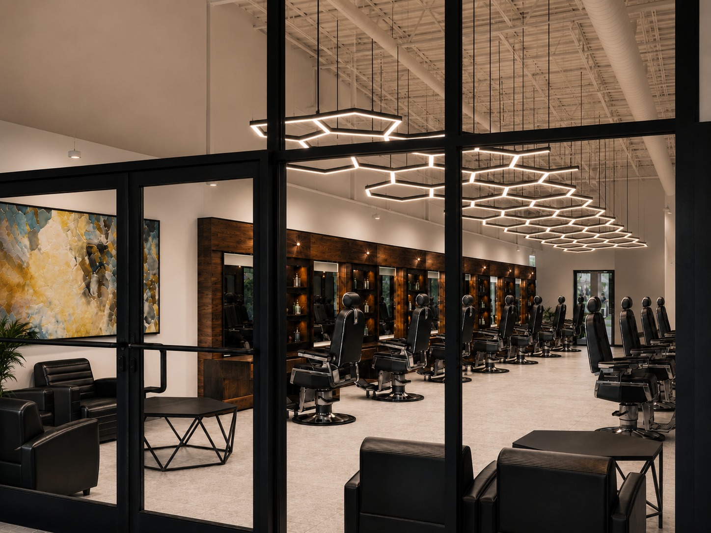 Stealth Cuts storefront — floor-to-ceiling glass with signature hexagon lighting over the barber floor